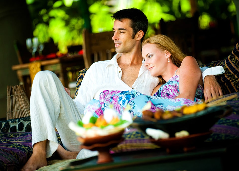 Couple Sitting on an Outdoor Couch